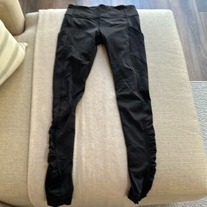 Lululemon leggings with pretty sheer back and gathering from the knee down.